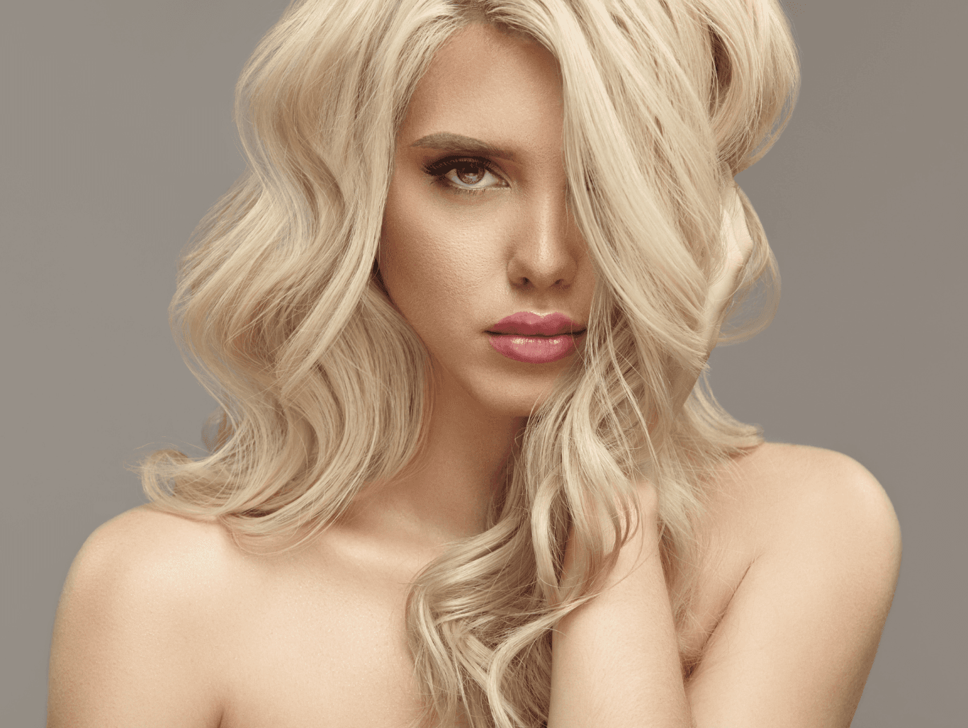 Model with soft, multi-tonal babylights creating a natural, seamless blonde effect after a professional service in Weymouth