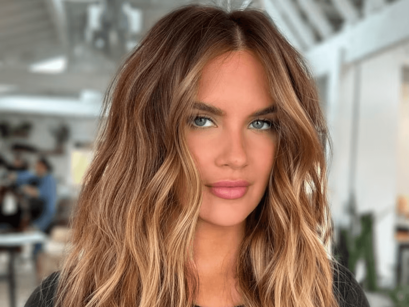Brunette woman with beachy waves hairstyle at Changing Grooms Hair and Beauty Spa in Weymouth