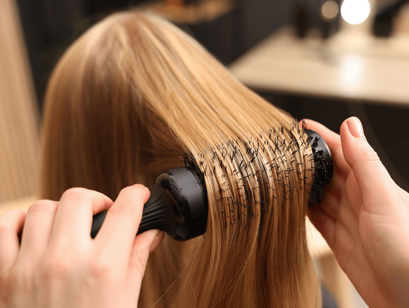Blow dry in progress on blonde hair after Olaplex No.2 treatment and professional restyle at a Weymouth salon