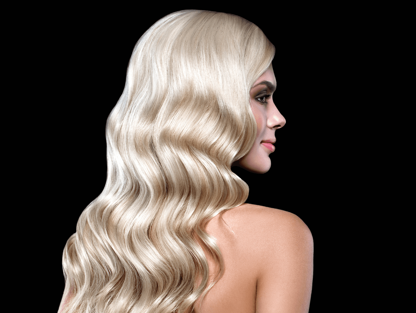 Blonde woman with flowing hair extensions at Changing Grooms salon in Weymouth Dorset.