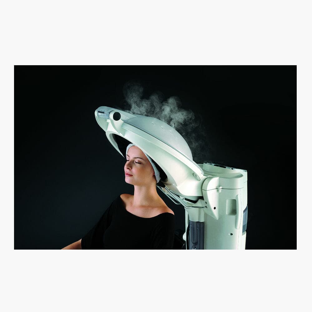 Woman receiving relaxing scalp facial treatment under a Takara Belmont Micro Mist processor at Changing Grooms salon in Weymouth.