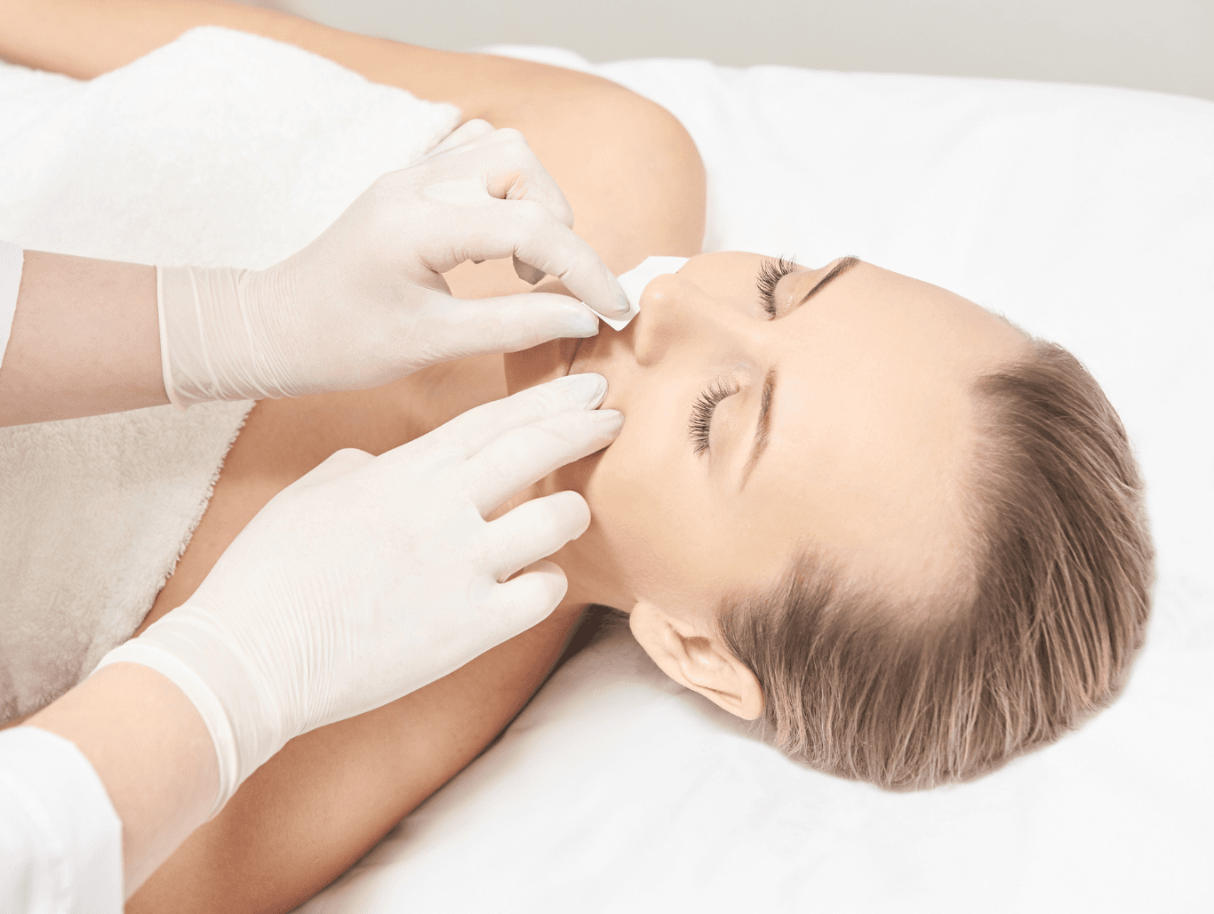 Client receiving upper lip and chin waxing in a professional salon setting in Weymouth for smooth, hair-free results