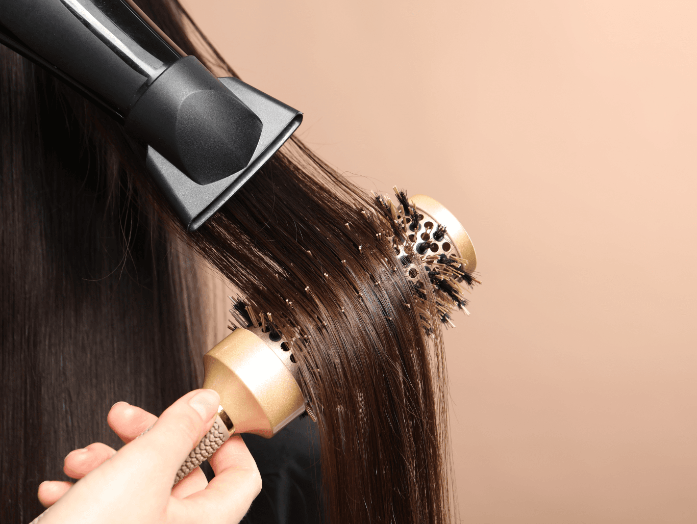Round-brush blow dry on glossy hair after a vegan, SLS-free shampoo and condition at a Weymouth hair salon