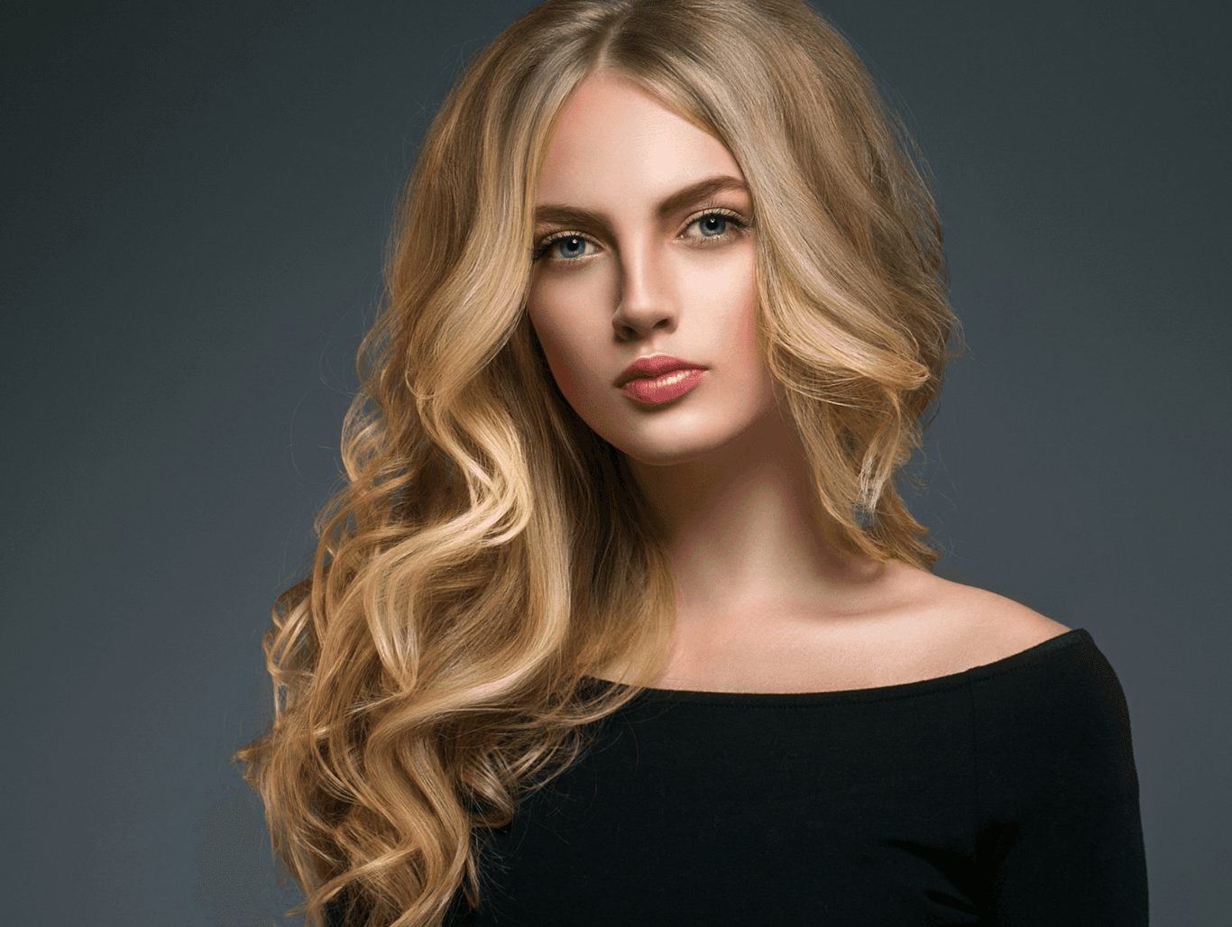 Model with full head of woven highlights created using Paper Not Foil and vegan colour at a professional hair salon in Weymouth
